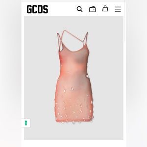 GCDS “sita drops” dress . The dress is mesh and features an ombré pink hue.